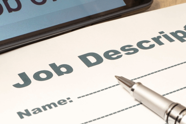 a sheet of paper titles Job Description with a pen resting on top