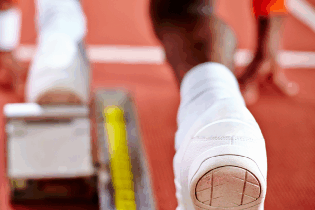 A view from behind a runner, about to start a race